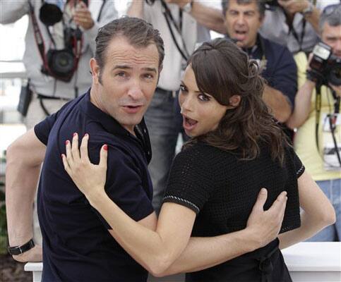 Actors Jean Dujardin, left, and Berenice Bejo pose during a photo call for The Artist, at the 64th international film festival, in Cannes.