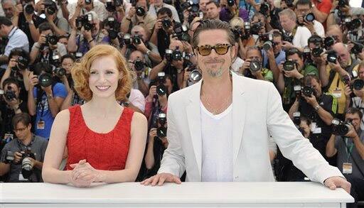 Actors Jessica Chastain, left, and Brad Pitt pose during a photo call for The Tree of Life at the 64th international film festival, in Cannes.