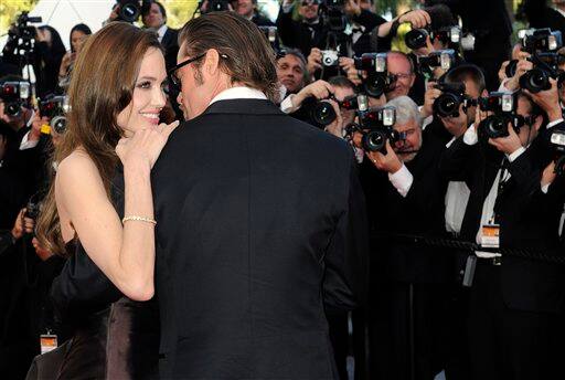 Actors Brad Pitt and Angelina Jolie pose on the red carpet for the screening of The Tree of Life at the 64th international film festival, in Cannes.