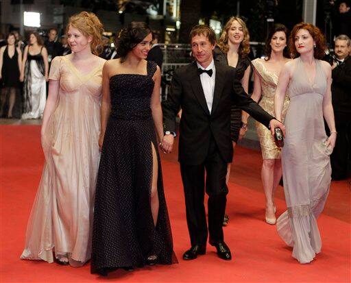 Director Bertrand Bonello, third from left, arrives with actresses, from left, Iliana Zabeth, Hafsia Herzi, Adele Haenel, Esther Garrel and Alice Barnole for the screening of L' Apollonide at the 64th international film festival, in Cannes.