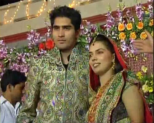 Vijender Singh and his bride Archana during the reception in Bhiwani.