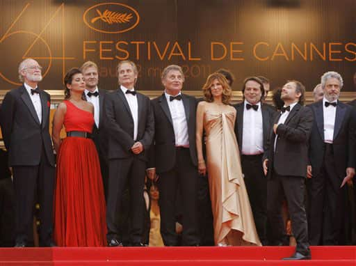 From fourth left, actor Hippolyte Girardot, screenwriter Patrick Rotman, actress Florence Pernel, director Xavier Durringer, actor Denis Podalydes and composer Nicola Piovani arrive for the screening of The Conquest at the 64th international film festival, in Cannes.