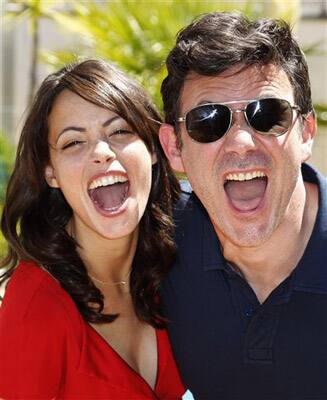 Actress Berenice Bejo, left, and director Michel Hazanavicius pose for portraits following an interview with The Associated Press during promotion for The Artist at the 64th international film festival, in Cannes.