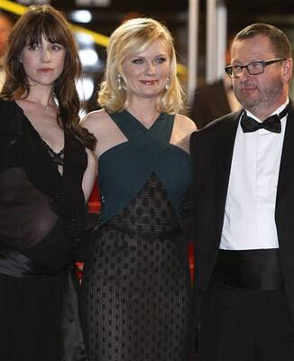 Actress' Charlotte Gainsbourg and Kirsten Dunst and Director Lars Von Trier pose as they arrive for the screening of Melancholia at the 64th international film festival, in Cannes.