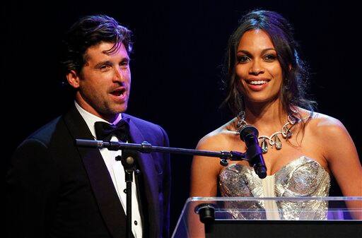 Actors Patrick Dempsey, left, and Rosario Dawson are seen on stage during the amfAR Cinema Against AIDS benefit at the Hotel du Cap-Eden-Roc, during the 64th Cannes international film festival, in Cap d'Antibes, southern France.