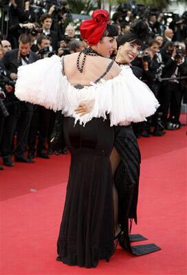 Actress Rossy de Palma, left, and an unidentified guest arrive for the screening of The Skin I Live In, at the 64th international film festival, in Cannes.