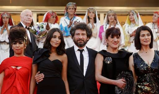 Director Radu Mihaileanu, center, arrives with actresses, from second left, Leila Bekhti, Biyouna and Hiam Abbas for the screening of The Source, at the 64th international film festival, in Cannes.