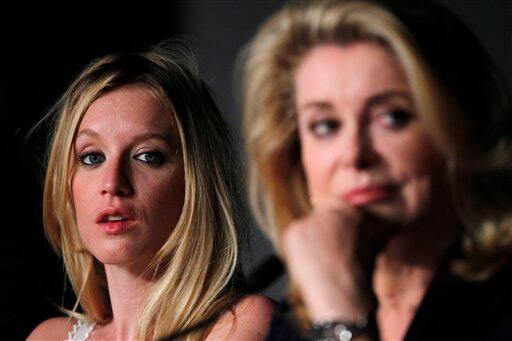 Actresses Ludivine Sagnier, left, and Catherine Deneuve attend a press conference for Beloved at the 64th international film festival, in Cannes.