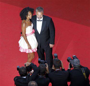 Director Luc Besson, right, and his wife Virginie Silla arrive for the screening of The Source, at the 64th international film festival, in Cannes.