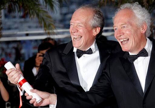 Directors Jean-Pierre Dardenne, right, and Luc Dardenne pose with the shared Grand Prix award during the awards photo call at the 64th international film festival, in Cannes.