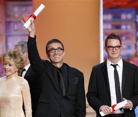 From left, actress Jane Fonda, director Nuri Bilge Ceylan, award recipient for the Grand Prix for the film Once Upon a Time in Anatolia, and director Nicolas Winding Refn, recipient of the Best Director prize for the film Drive during the awards ceremony at the 64th international film festival.