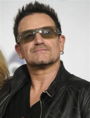 Singer Bono of the rock band U2 poses in the press room at the 2011 Billboard Music Awards.