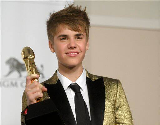 Singer Justin Bieber poses in the press room at the 2011 Billboard Music Awards.