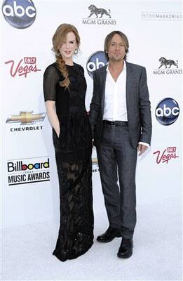 Actress Nicole Kidman, left, and singer Keith Urban arrive at the 2011 Billboard Music Awards.