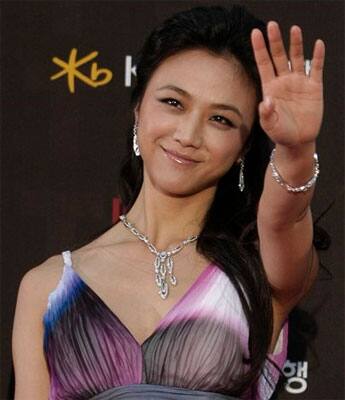 Chinese actress Tang Wei waves before the Baeksang Arts Awards 2011 in Seoul.