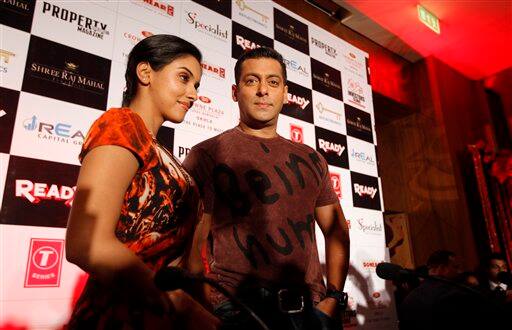 Bollywood actors Salman Khan, right, and Asin interact with the media ahead of the release of their new movie 'Ready' in New Delhi.