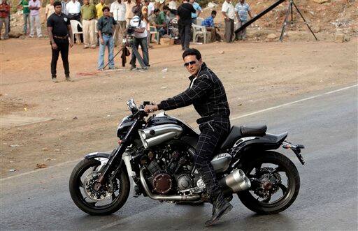 Akshay Kumar poses for the media before performing a stunt for a promotional event in Mumbai. 