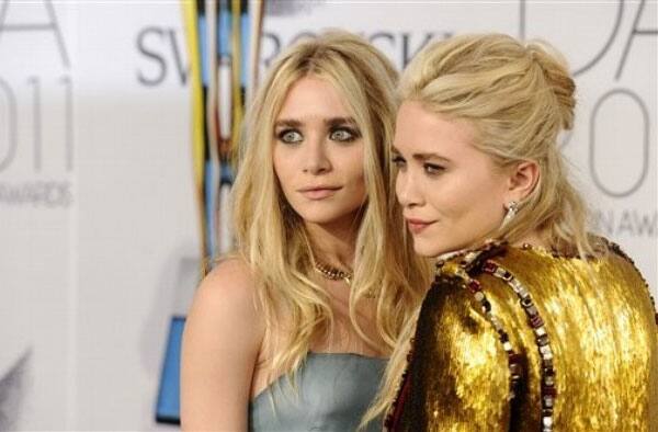 Ashley Olsen, left, and Mary-Kate Olsen attend the 2011 CFDA Fashion Awards at Alice Tully Hall  in New York.