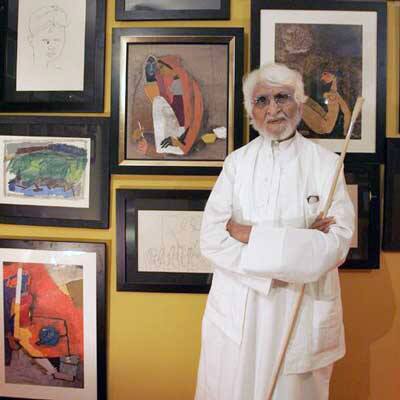 MF Husain showcasing his paintings.