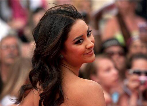 Canadian actress and model Shay Mitchell arrives on the red carpet during the 2011 MuchMusic Video Awards in Toronto.