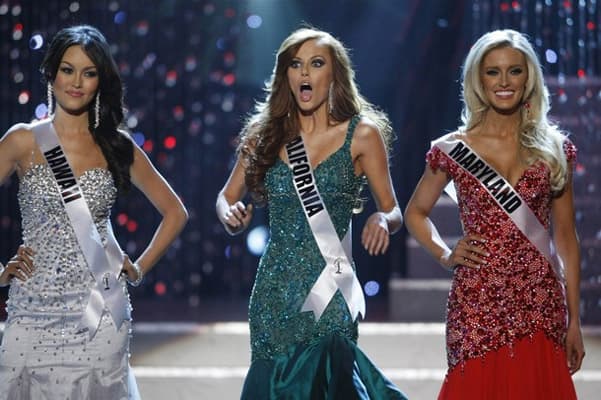 Miss California Alyssa Campanella (C) reacts as she is chosen as the last of the final four finalists during the 2011 Miss USA pageant in the Theatre for the Performing Arts  in Las Vegas. Miss Hawaii Angela Byrd (L) and and Miss Maryland Allyn Rose stand by.