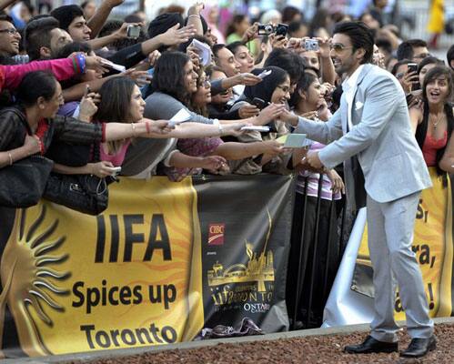 Bollywood actor Aashish Chaudhary greets fans at the world premiere of the film 