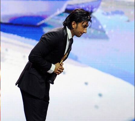 Actor Ranbir Singh reacts after receiving Best Debut Actor award from Rishi and Nitu Kapoor during 2011 International Indian Film Academy (IIFA) awards at the Rogers Centre in Toronto.