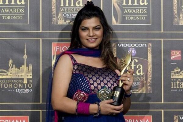 Bollywood star Mamta Sharma poses with her award for Playback Singer Female at the 2011 International Indian Film Academy Awards.