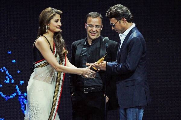 Actor Irfan Khan receives an award for Achivement in International field during 2011 International Indian Film Academy (IIFA) awards.