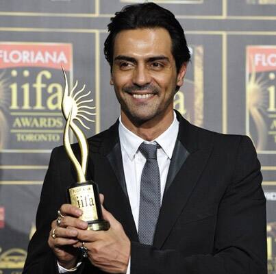 Actor Arjun Rampal poses with his award for best supporting male for his role in 