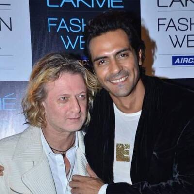 Arjun Rampal poses with Rohit Bal at the post show bash in Tote, Mumbai.