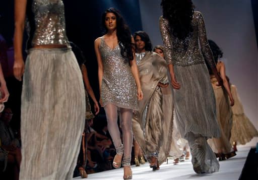 Models display designer Rina Dhaka creations during the Lakme Fashion Week in Mumbai.