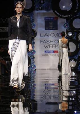 An Indian model displays designer J.J. Vallaya creations during the Lakme Fashion Week in Mumbai.