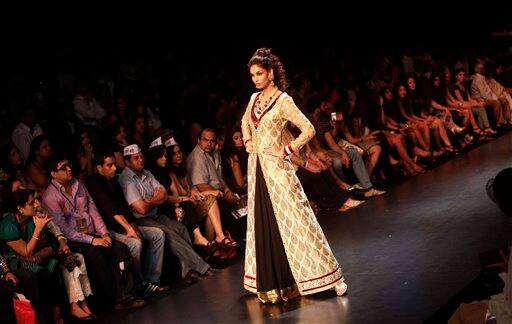 An Indian model displays creations by designers Shyamal and Bhumika during Lakme Fashion Week .