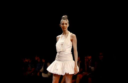 An Indian model displays creations by designer Rehane during the Lakme Fashion Week .