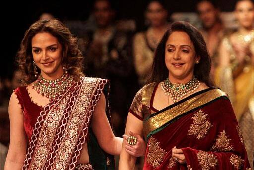 Hema Malini and her daughter Esha Deol display creations by designers Shyamal and Bhumika during Lakme Fashion Week.