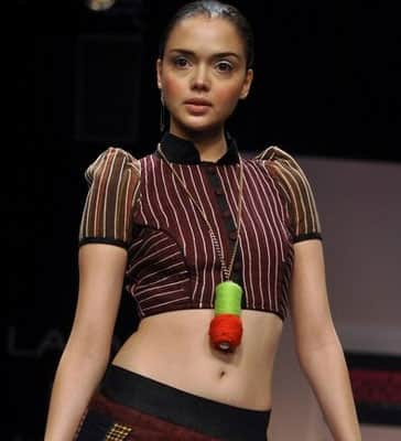 An Indian model displays a creation by designer Sabah Khan on the fifth day of Lakme Fashion Week .