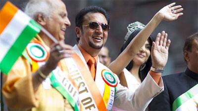 Actor Gulshan Grover waves to fans during the 31st India Day Parade in New York. 