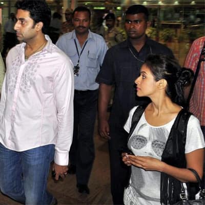 Abhishek Bachchan and Asin spotted at the Mumbai airport. 