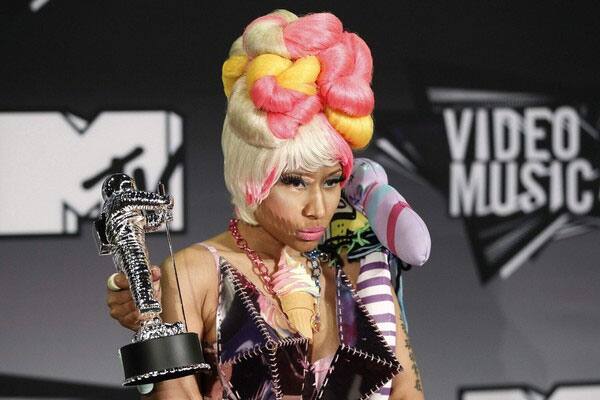 Singer Nicki Manaj poses with the award for Best Hip Hop Video she won at the 2011 MTV Video Music Awards in Los Angeles.