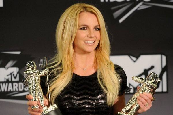 Singer Britney Spears, winner of the Video Vanguard Award and Best Pop Video Award for 'Till the World Ends' poses in the press room during the 2011 MTV Video Music Awards  in Los Angeles.