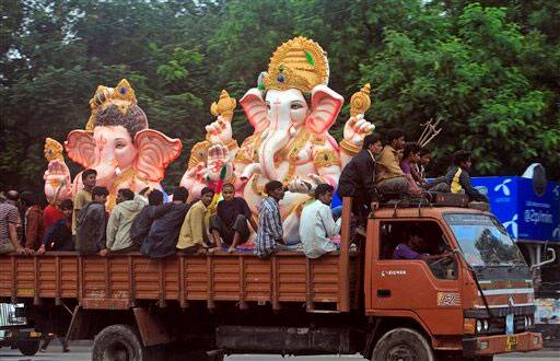 Indian Hindus carry idols of elephant-headed god Ganesha on a truck ahead of Ganesh Chaturti festival in Hyderabad.