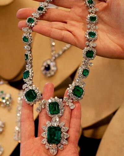 Elizabeth Taylor's emerald and diamond necklace and pendant, attached at the bottom, part of a suite by BVLGARI, a gift of Richard Burton, are shown in this photograph at Christie's, in New York. Christie’s auction house is selling the late actress's complete jewelry collection in New York. 