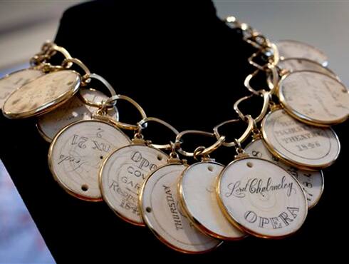  Elizabeth Taylor's gold and ivory necklace featuring ivory opera passes, circa 18th and 19th centuries was a gift from the estate of Edith Head to the late actress.