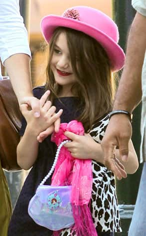 Tom Cruise's daughter Suri spotted wearing red lip sticks.