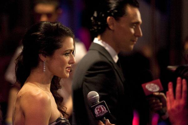 Rachel Weisz, left, and Tom Hiddleston conduct television interviews as they arrive for the gala screening of the film 