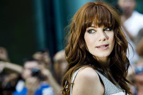 Actress Michelle Monaghan poses for photographs on the red carpet as she arrives for the new movie 