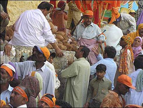 Devotees gather in large numbers to buy coconuts from vendors.