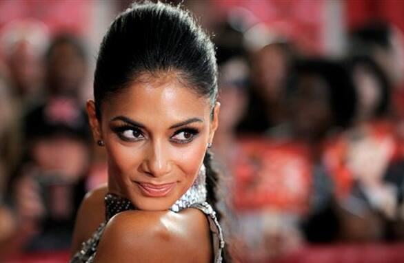 Nicole Scherzinger, a judge on 'The X Factor,' poses at a world premiere screening event for the new television series in Los Angeles.