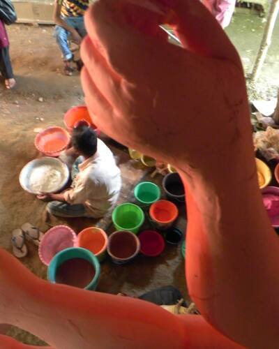 A craftsman mixes colours at a workshop ahead of Durga Puja in New Delhi.